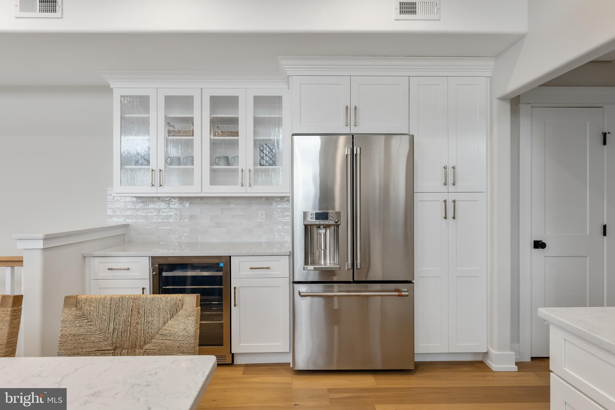 16 67th Street Sea Isle City, NJ 08243 - Photo 30 of 40 a metallic refrigerator freezer sitting in a kitchen