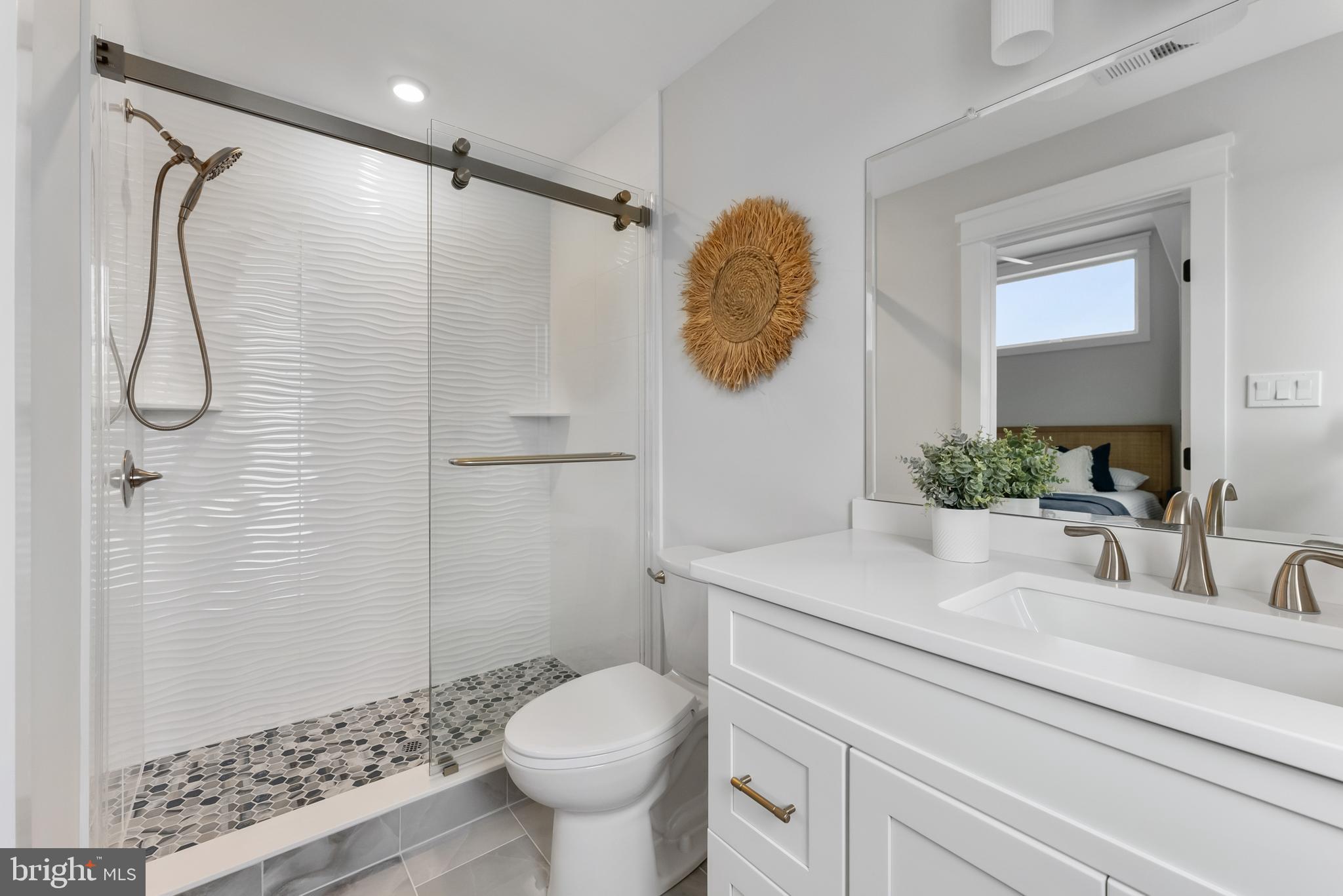16 67th Street Sea Isle City, NJ 08243 - Photo 35 of 40 a bathroom with a granite countertop sink toilet and shower