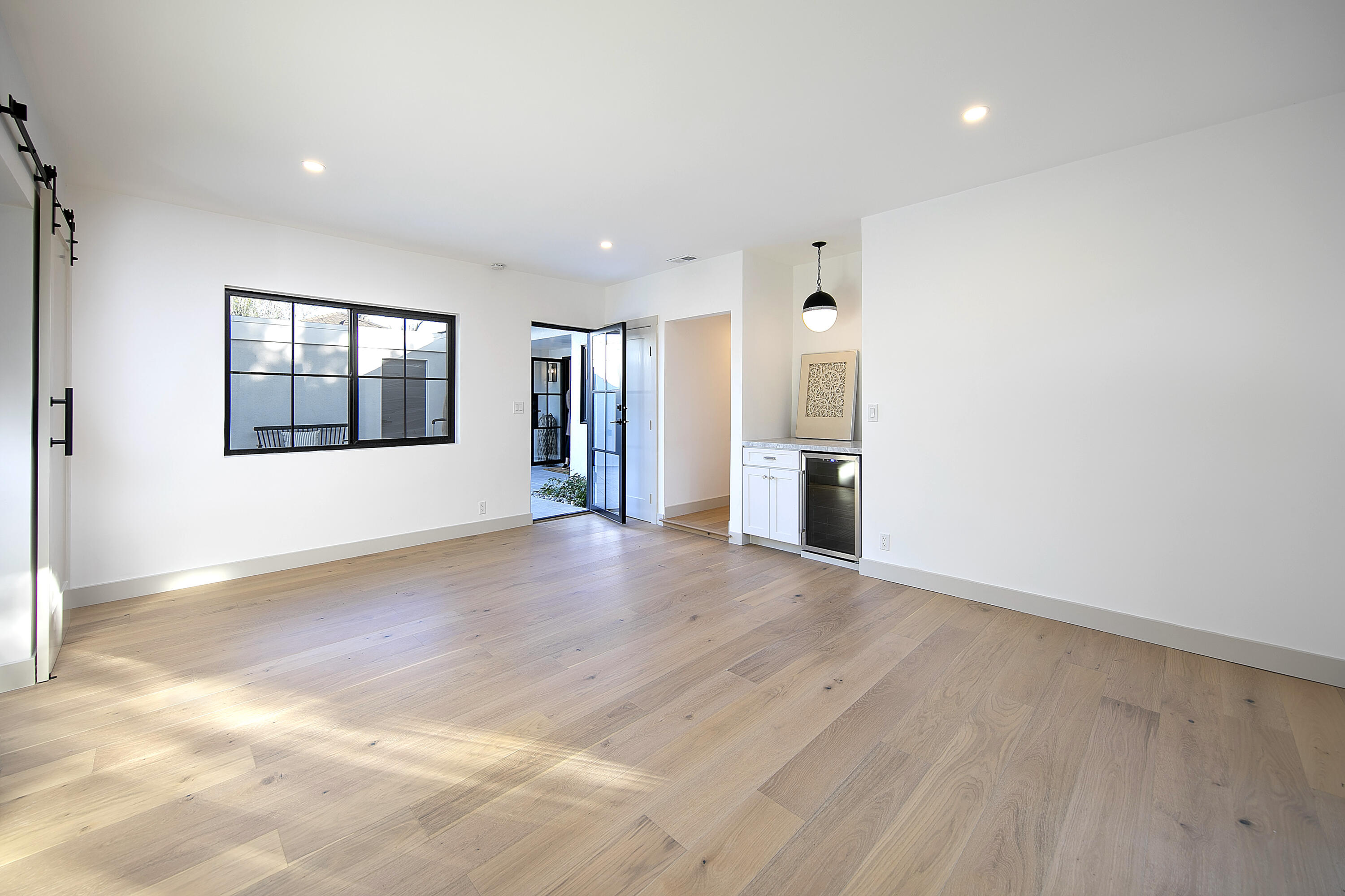 1514 Crestline Drive Santa Barbara, CA 93105 - Photo 13 of 25 an empty room with a fireplace and windows