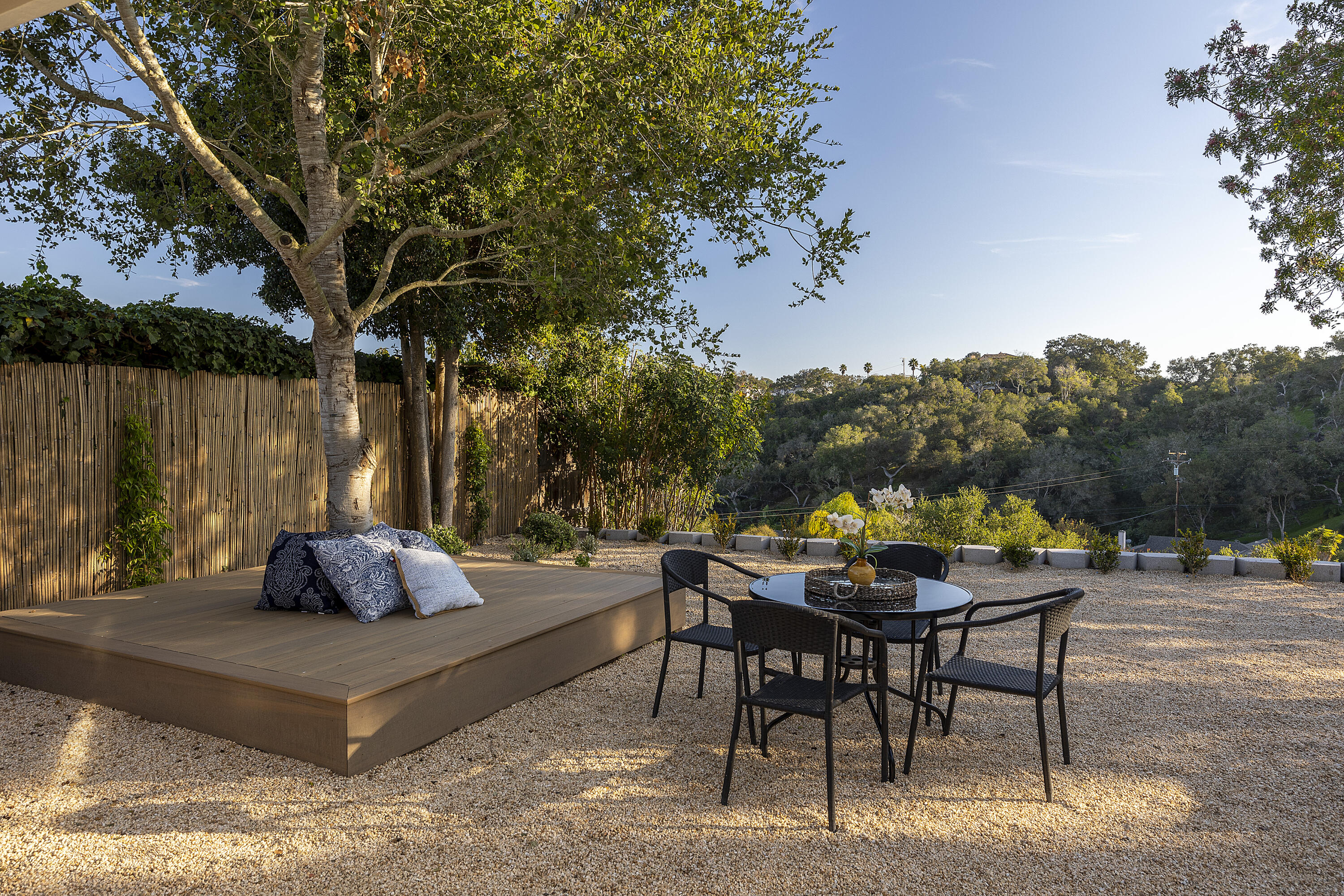 1514 Crestline Drive Santa Barbara, CA 93105 - Photo 19 of 25 a table and chairs sitting in a backyard with swimming pool