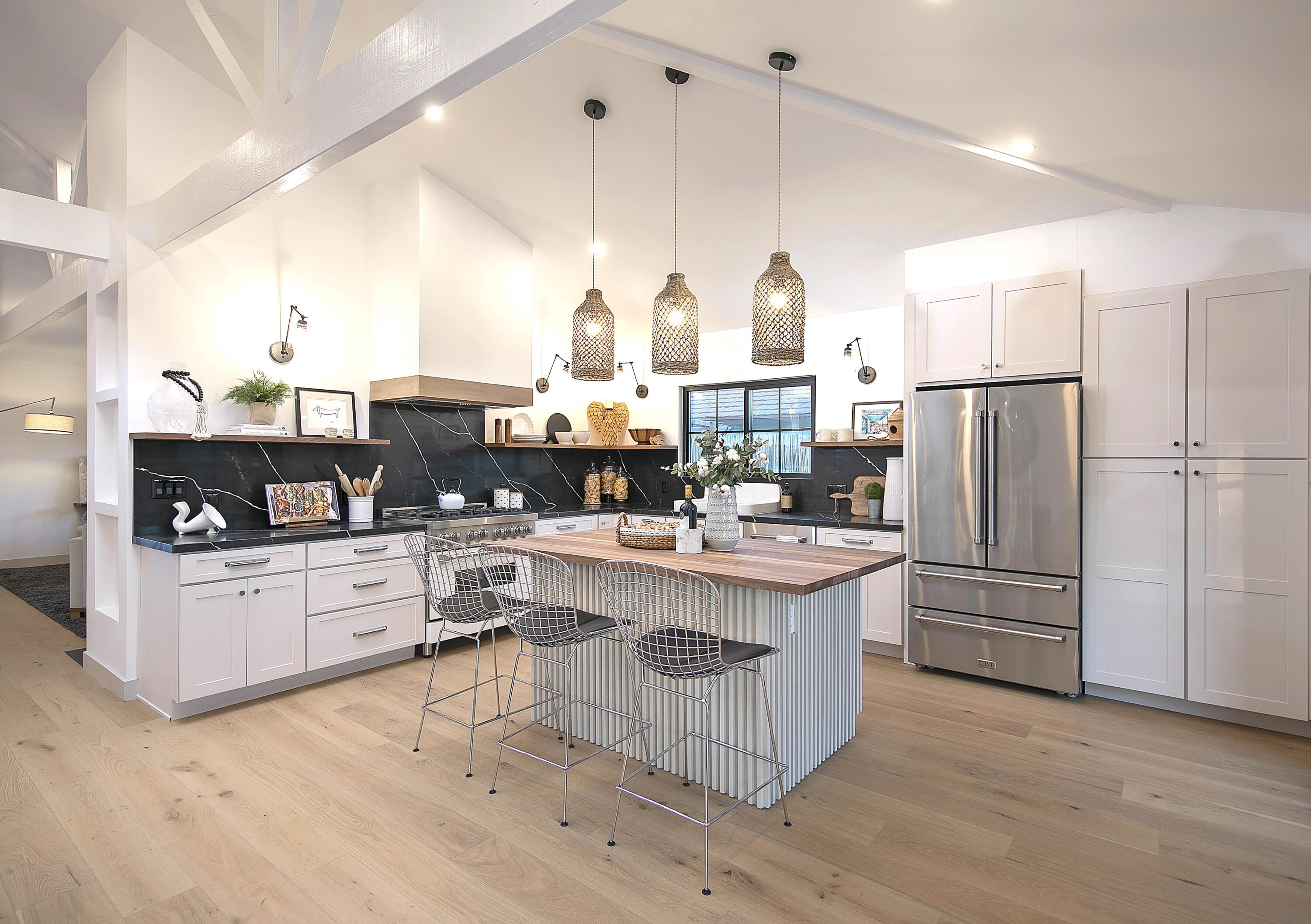 1514 Crestline Drive Santa Barbara, CA 93105 - Photo 9 of 25 a kitchen with stainless steel appliances kitchen island granite countertop a refrigerator a stove a sink dishwasher and white cabinets with wooden floor