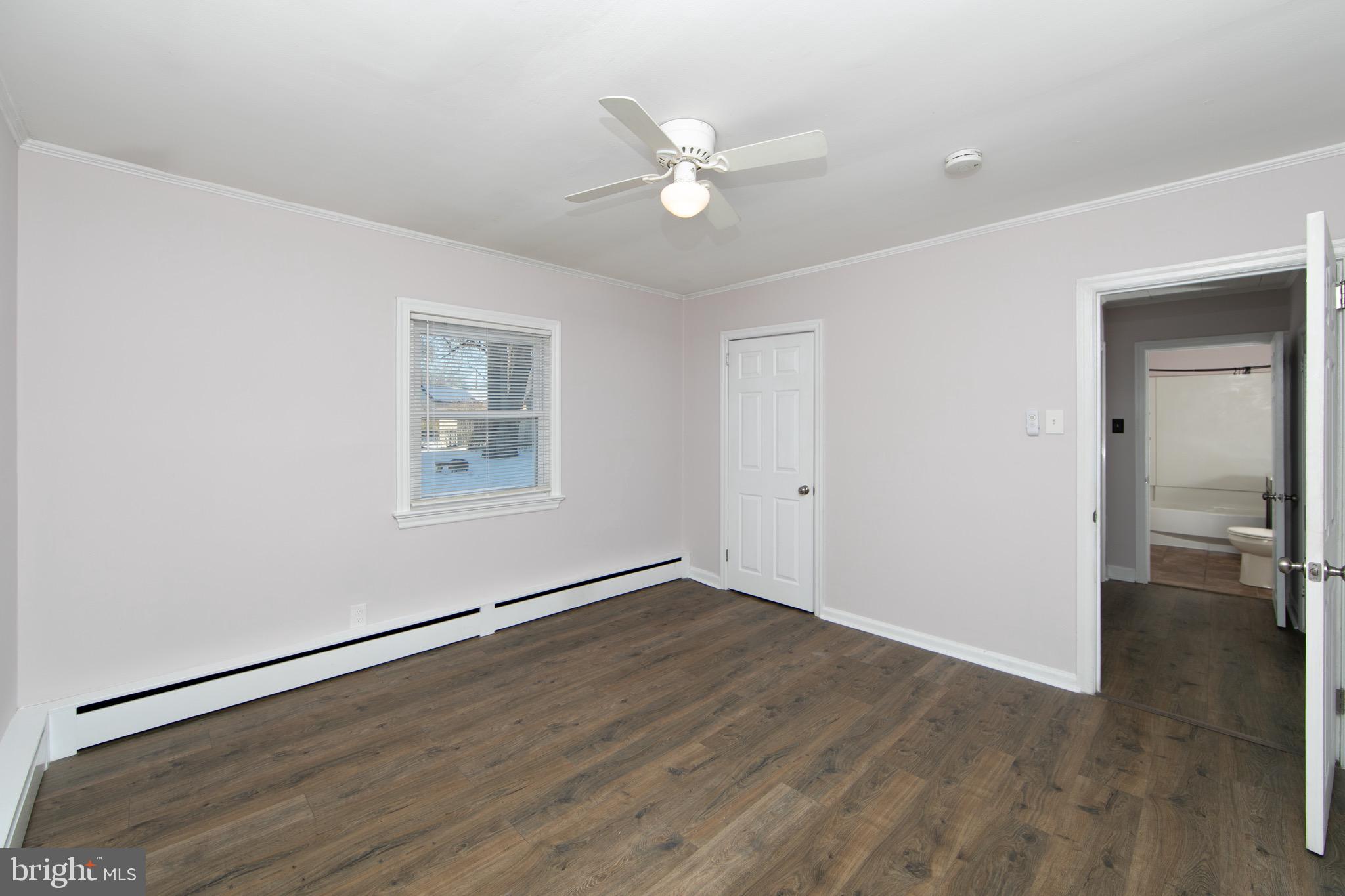 553 Maple Avenue Audubon, NJ 08106 - Photo 14 of 49 wooden floor in an empty room with a window