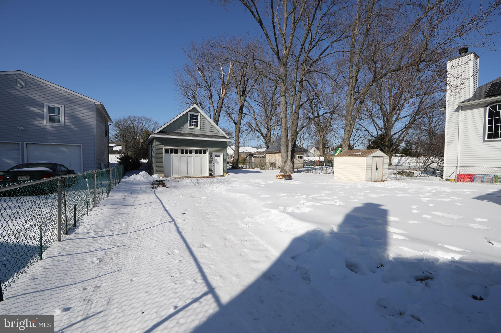 553 Maple Avenue Audubon, NJ 08106 - Photo 40 of 49 a front view of a building with large trees