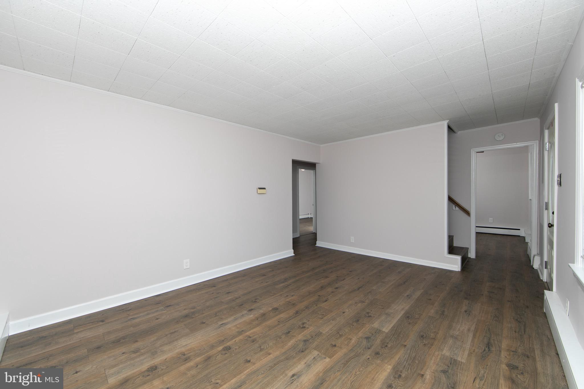 553 Maple Avenue Audubon, NJ 08106 - Photo 4 of 49 a view of an empty room with wooden floor and closet