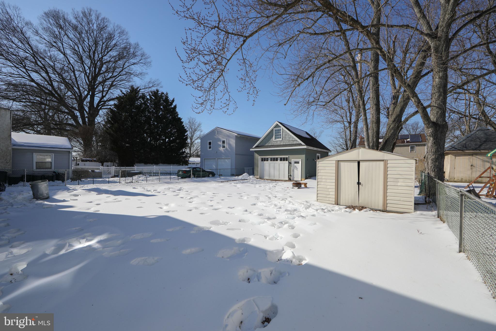 553 Maple Avenue Audubon, NJ 08106 - Photo 41 of 49 a view of white house with a yard covered in snow