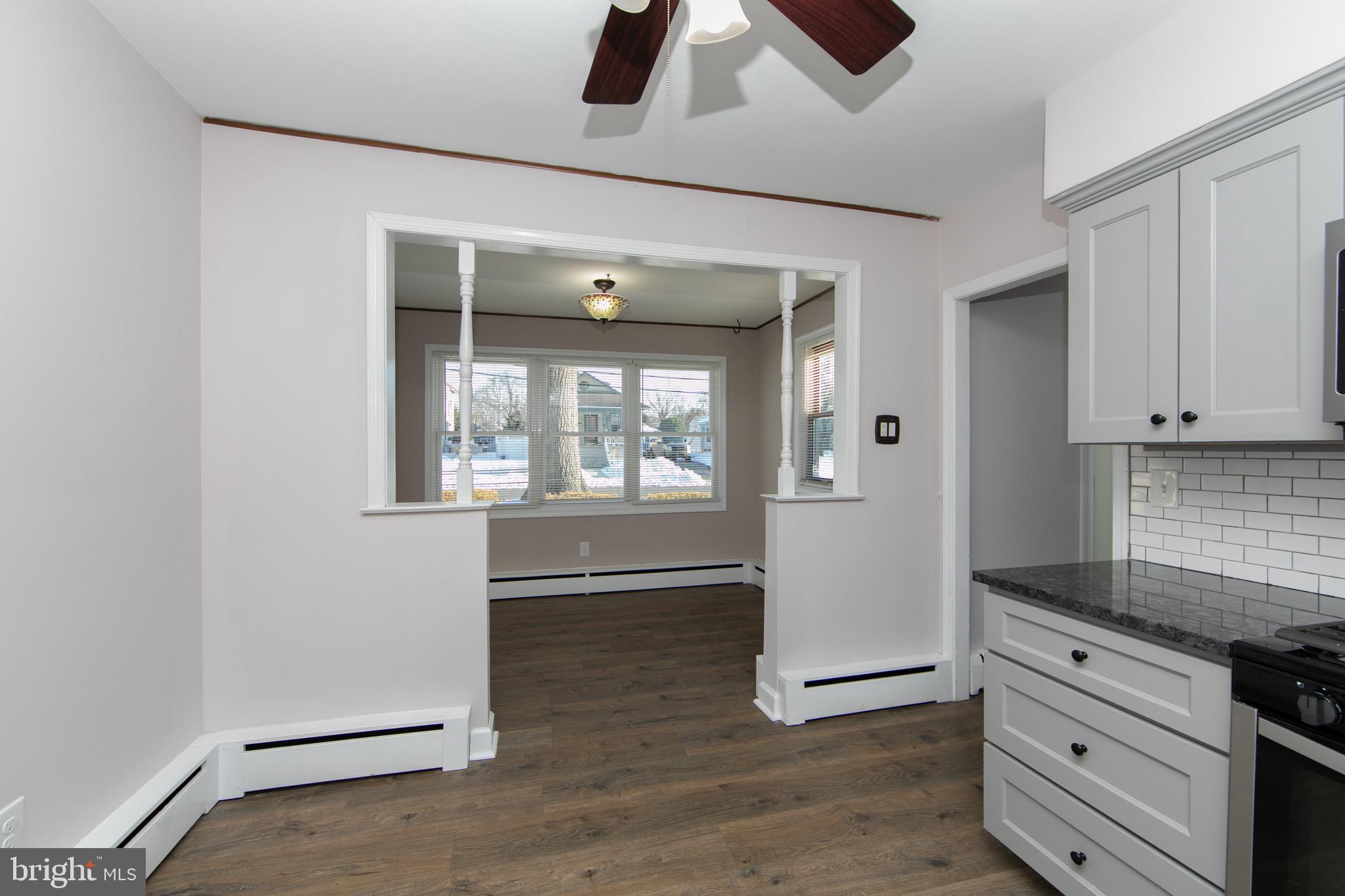 553 Maple Avenue Audubon, NJ 08106 - Photo 7 of 49 wooden floor with cabinets and window