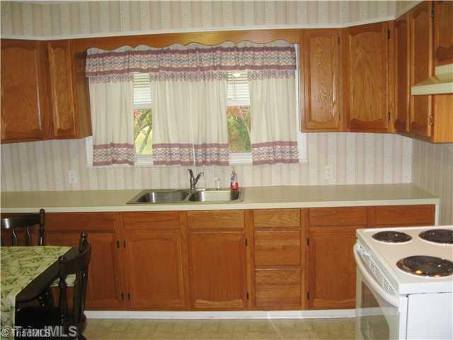 6080 Pine Hall Road Walnut Cove, NC 27052 - Photo 5 of 16 Kitchen. Stove, refrigerator, washer and dryer are included.