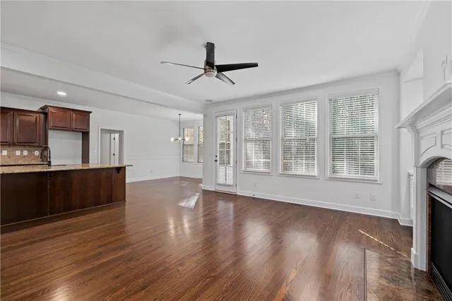 a view of kitchen with furniture and wooden floor