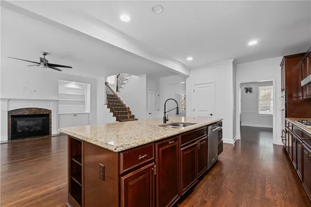 a kitchen with a stove and a refrigerator