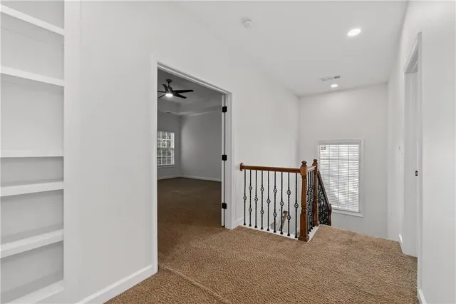 a view of a hallway with entryway door