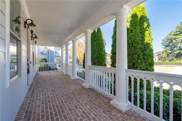 a view of a porch with potted plants