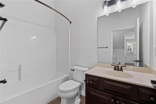 a view of an empty room with closet