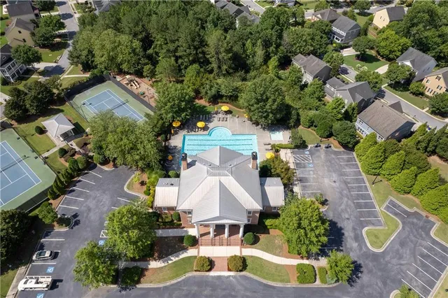 an aerial view of residential house with outdoor space and swimming pool