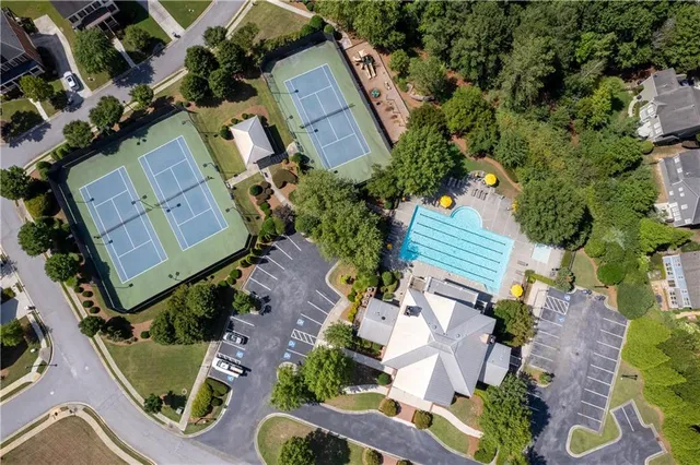 a front view of a house with a garden and sitting area