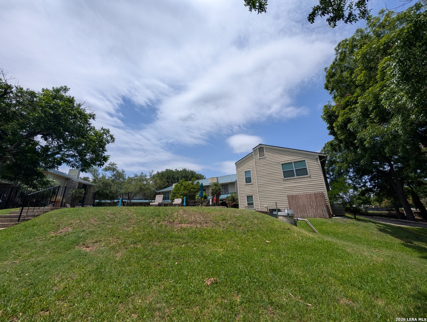 551 Terminal Loop Road, Unit D5 McQueeney, TX 78123 - Photo 35 of 42 a view of a house with a big yard