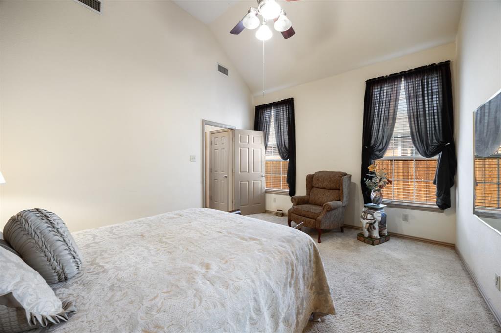 155 Lexington Drive Terrell, TX 75160 - Photo 15 of 27 a bedroom with a bed couch and a window