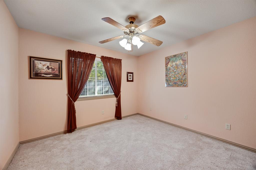 155 Lexington Drive Terrell, TX 75160 - Photo 19 of 27 wooden floor in an empty room with a window
