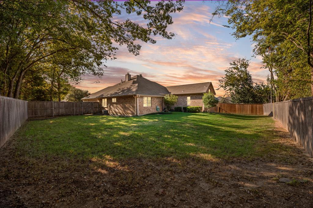 155 Lexington Drive Terrell, TX 75160 - Photo 25 of 27 a view of a house with a back yard