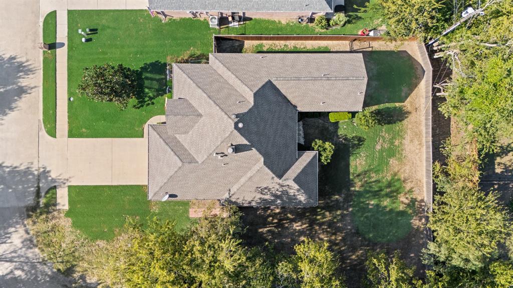 155 Lexington Drive Terrell, TX 75160 - Photo 26 of 27 an aerial view of a house with a yard and a large tree