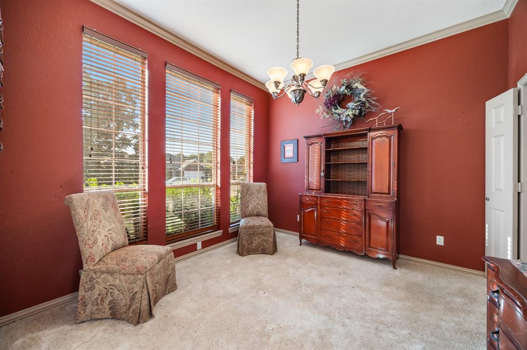 155 Lexington Drive Terrell, TX 75160 - Photo 5 of 27 a living room with furniture and a chandelier