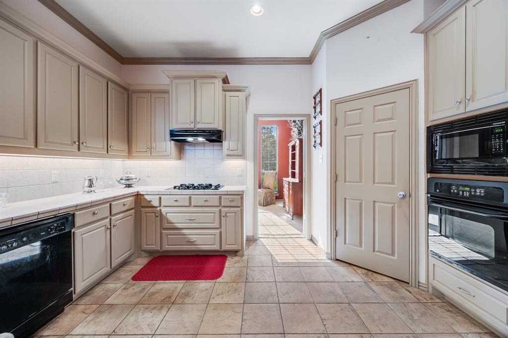 155 Lexington Drive Terrell, TX 75160 - Photo 9 of 27 a kitchen with stainless steel appliances granite countertop a refrigerator and a stove top oven
