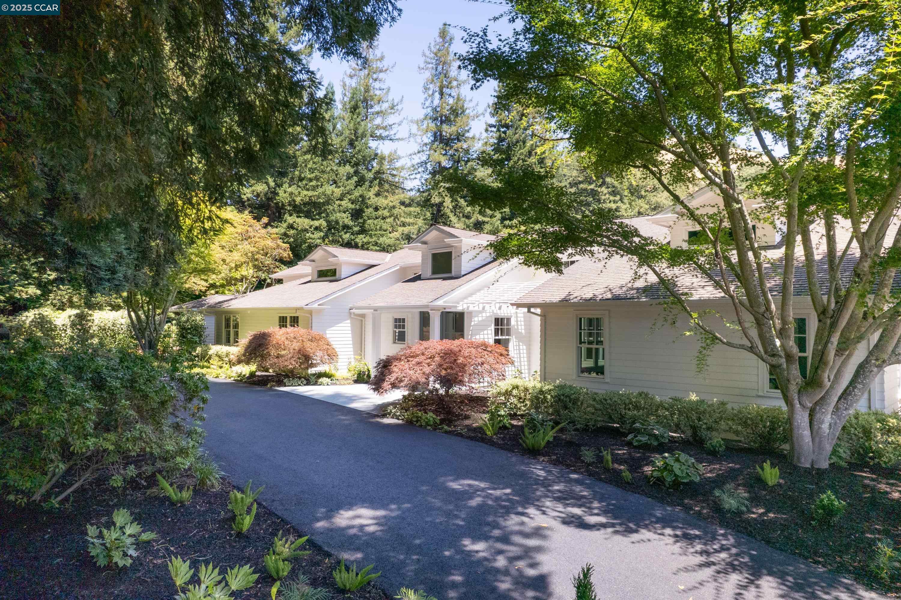 a front view of a house with garden