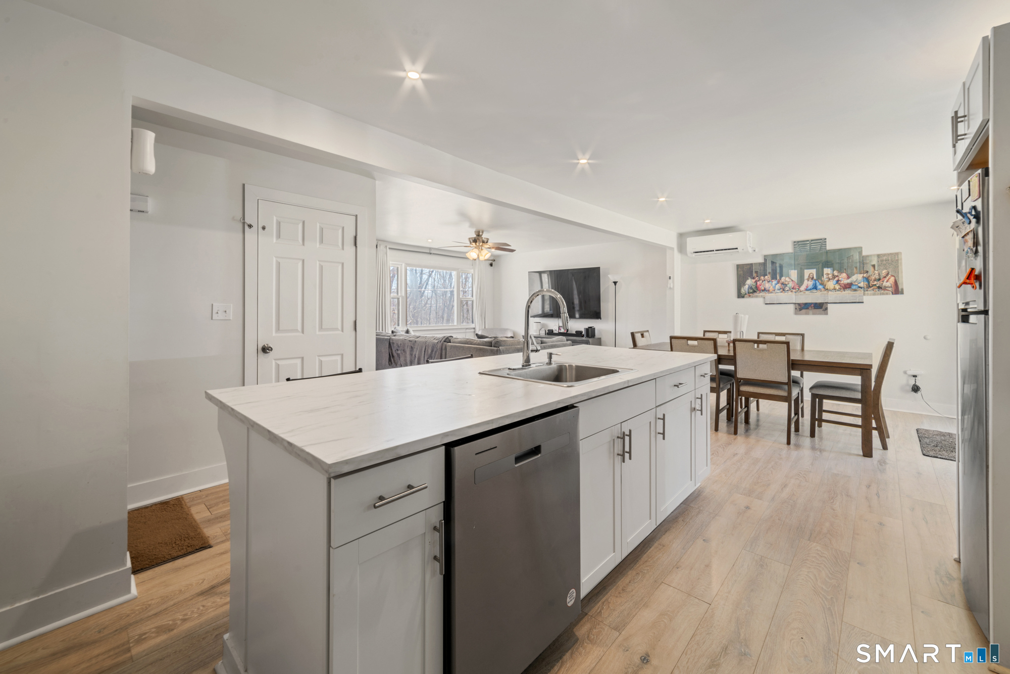 327 Lakeside Boulevard West Waterbury, CT 06708 - Photo 4 of 29 a kitchen with white cabinets and sink