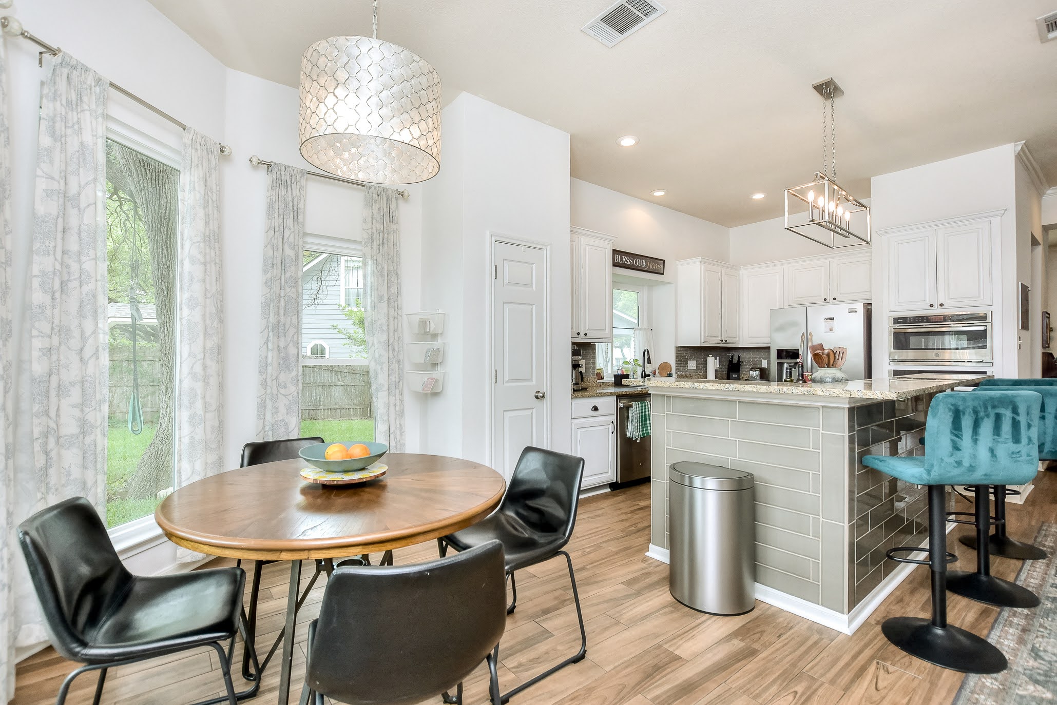 111 Green Grove Georgetown, TX 78633 - Photo 14 of 40 Dining area with suspended lighting and light wood-style flooring