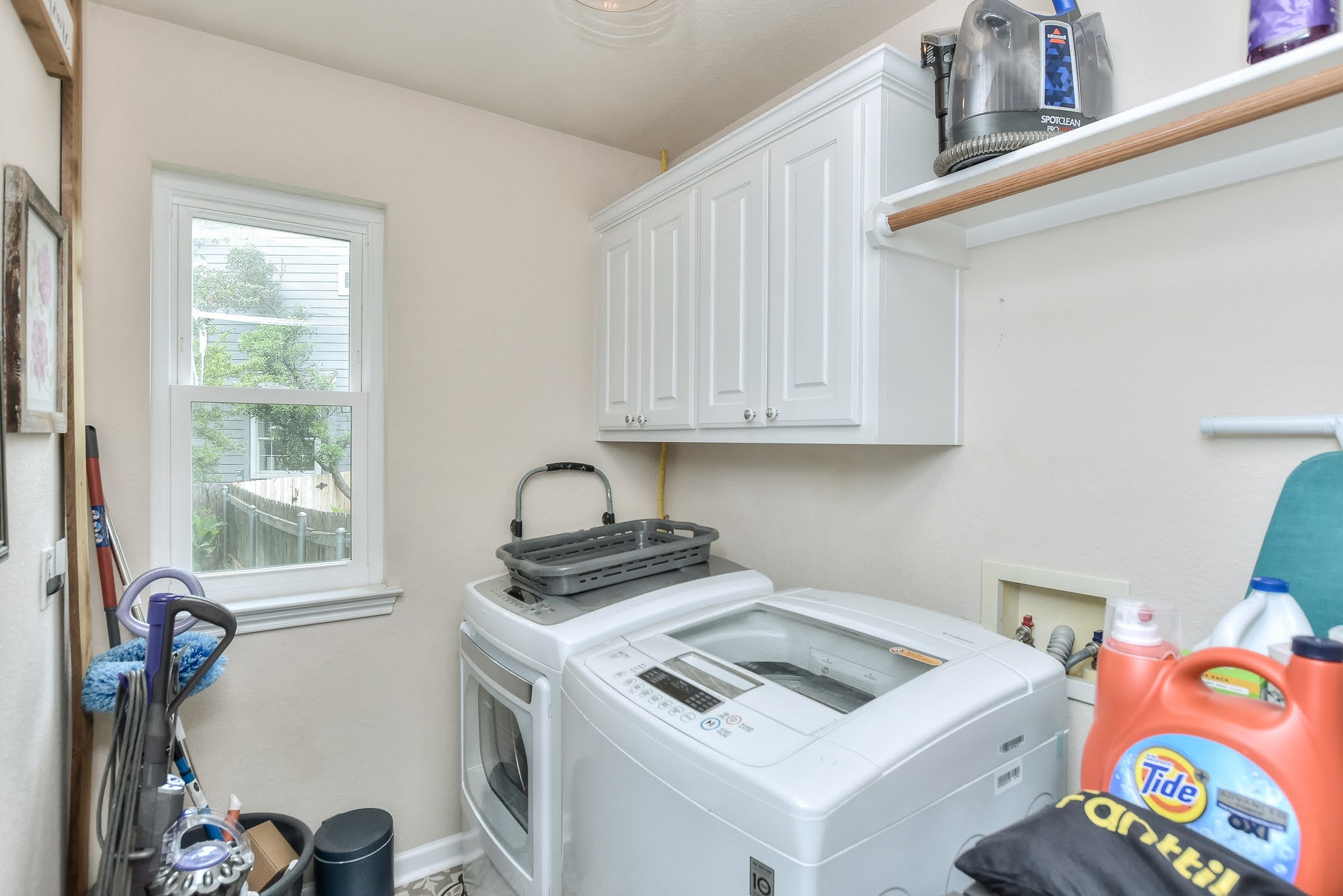 111 Green Grove Georgetown, TX 78633 - Photo 15 of 40 Laundry area with washer and dryer and cabinet space
