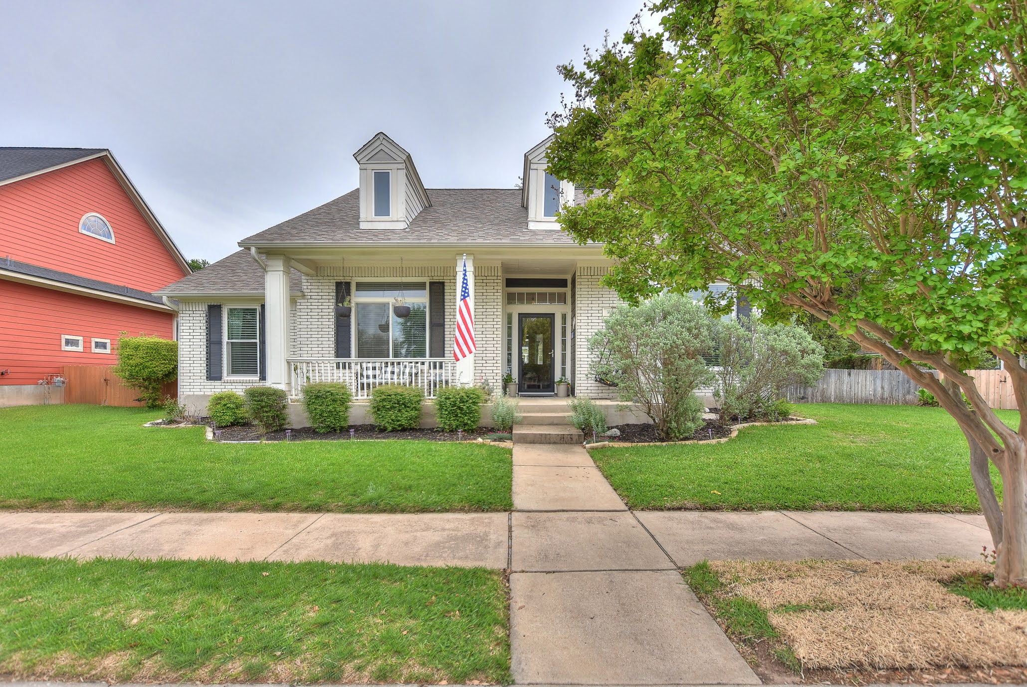 111 Green Grove Georgetown, TX 78633 - Photo 2 of 40 View of front of house featuring covered porch, brick siding, and a shingled roof