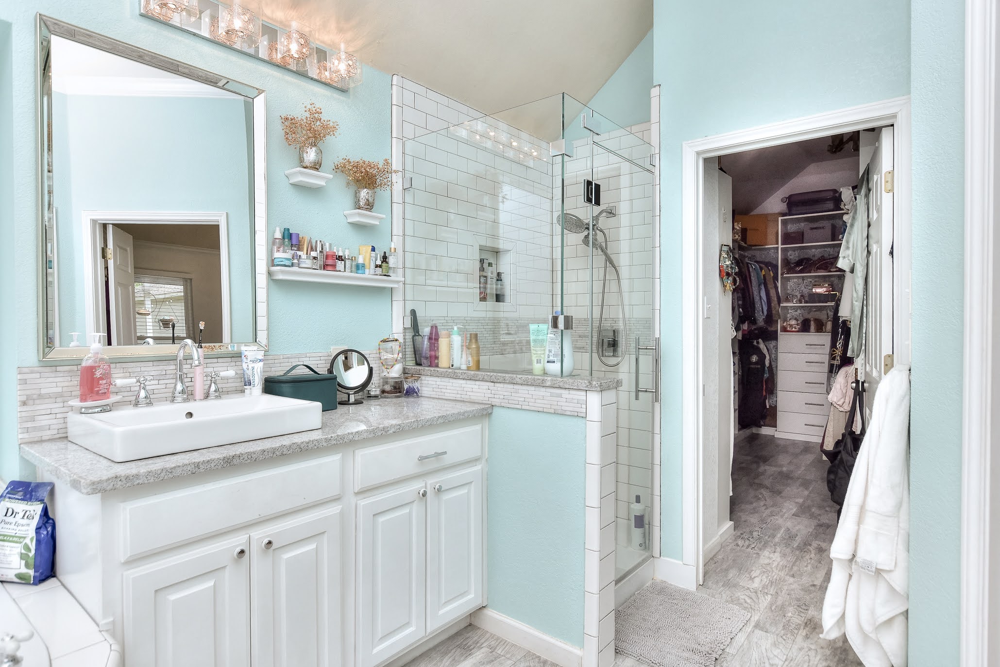 111 Green Grove Georgetown, TX 78633 - Photo 29 of 40 Bathroom with a walk in closet, vanity, and a stall shower