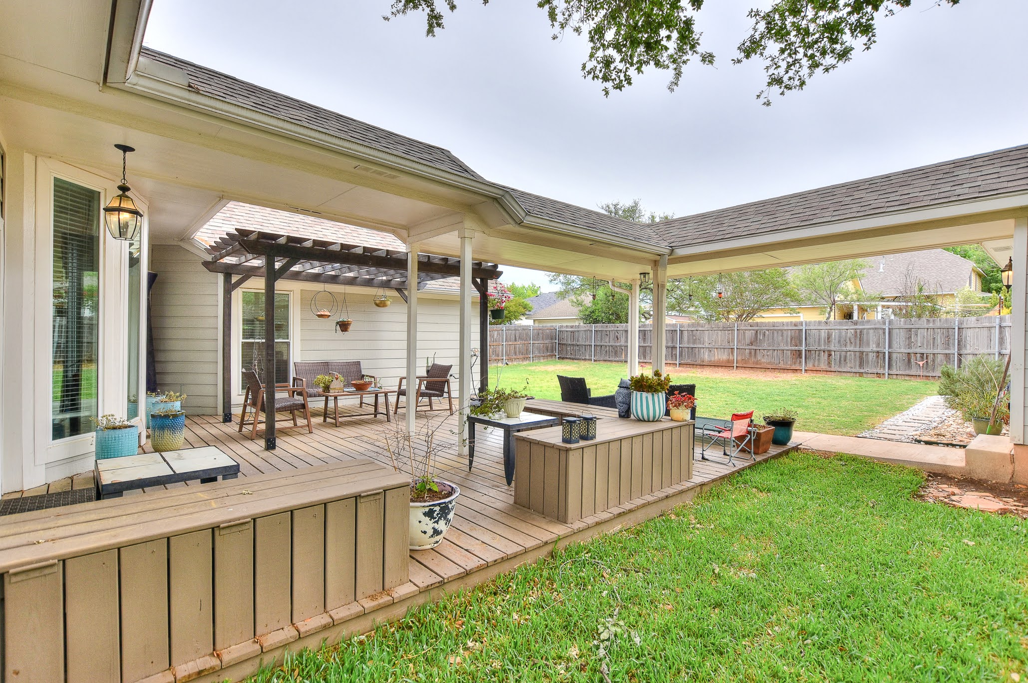 111 Green Grove Georgetown, TX 78633 - Photo 31 of 40 Wooden deck with an outdoor living space, a fenced backyard, a pergola, and a patio