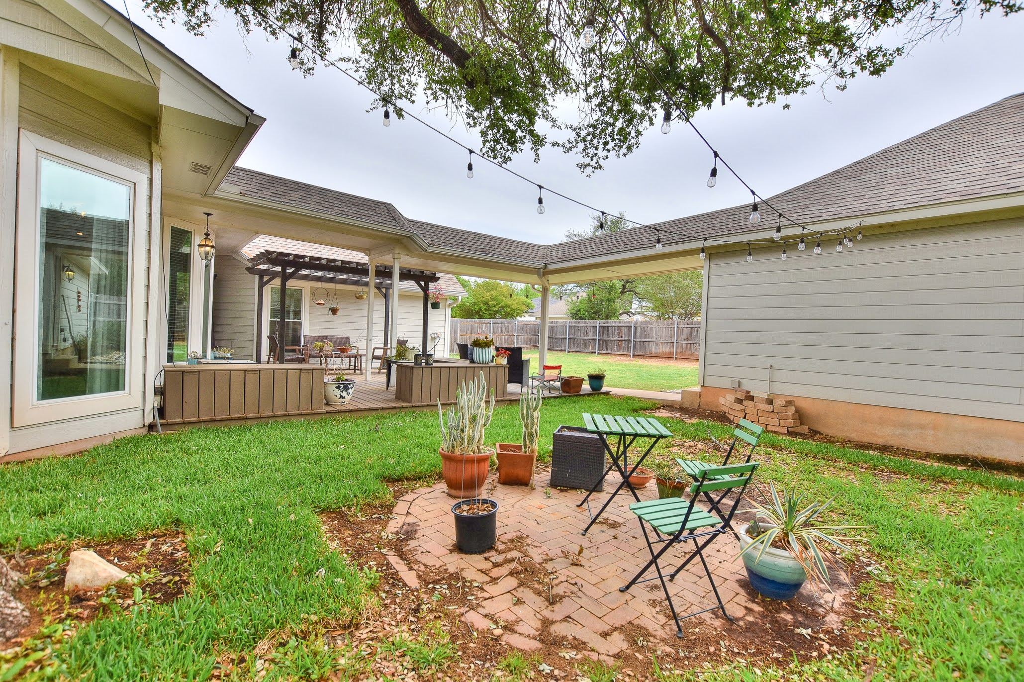 111 Green Grove Georgetown, TX 78633 - Photo 33 of 40 Fenced yard with a patio, a pergola, and a wooden deck