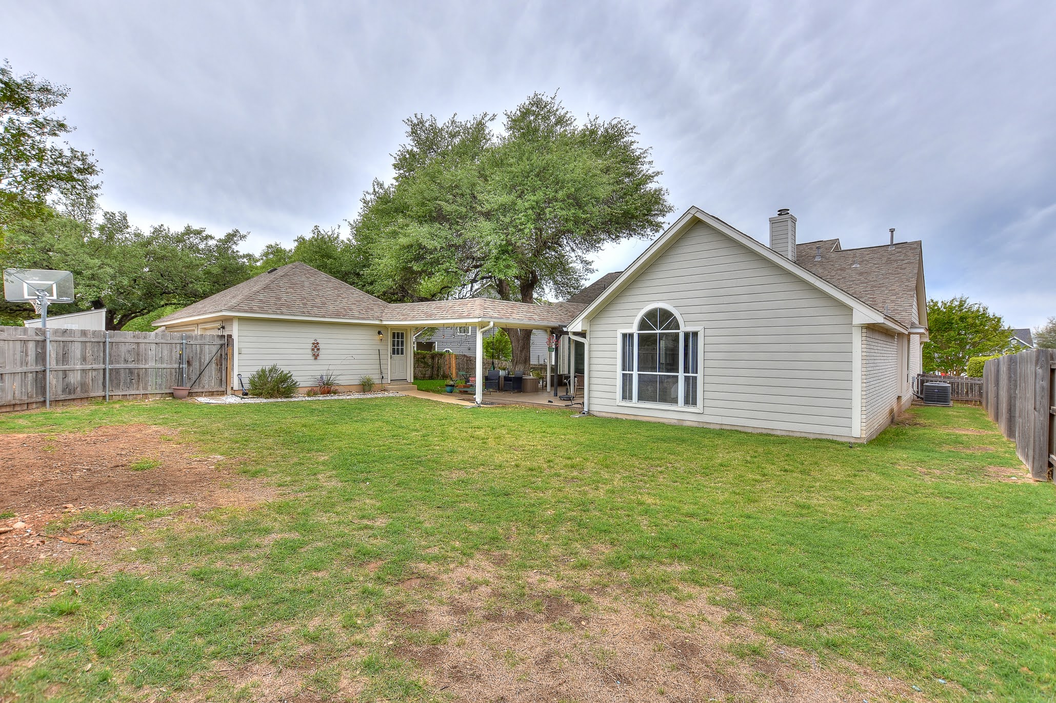 111 Green Grove Georgetown, TX 78633 - Photo 39 of 40 Rear view of house with a fenced backyard, a patio area, a chimney, a gate, and a shingled roof