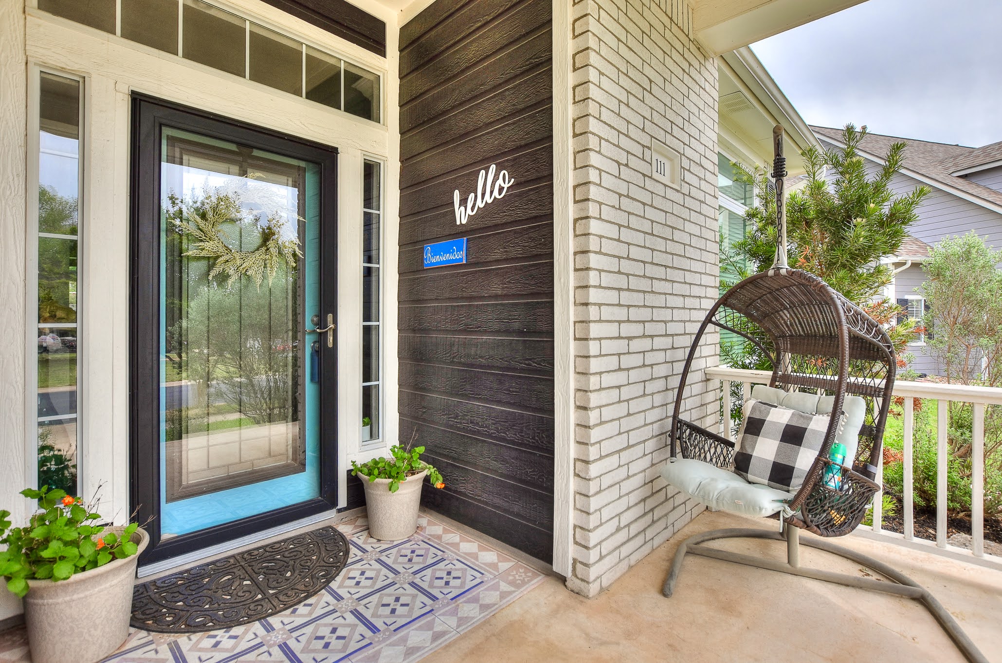 111 Green Grove Georgetown, TX 78633 - Photo 4 of 40 Doorway to property featuring brick siding and covered porch