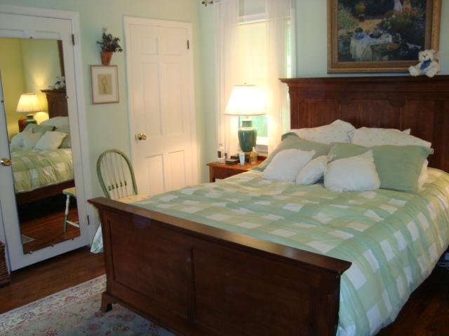 Undisclosed Address New Canaan, CT 06840 - Photo 14 of 14 a bedroom with a bed and a painting on the wall