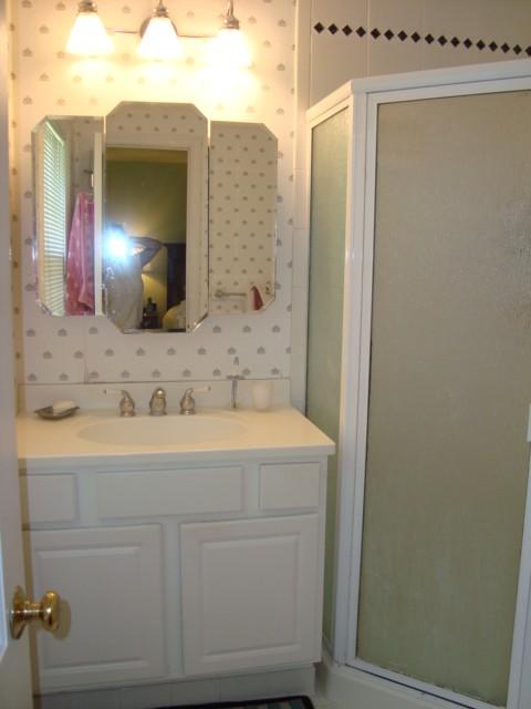 Undisclosed Address New Canaan, CT 06840 - Photo 3 of 14 a bathroom with a sink and a mirror
