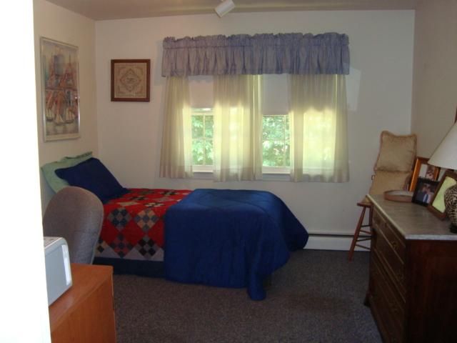 Undisclosed Address New Canaan, CT 06840 - Photo 4 of 14 a bedroom with a bed and a window