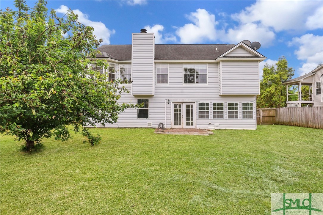 208 Stonebridge Drive Savannah, GA 31410 - Photo 39 of 40 Exterior Rear, view of pear tree