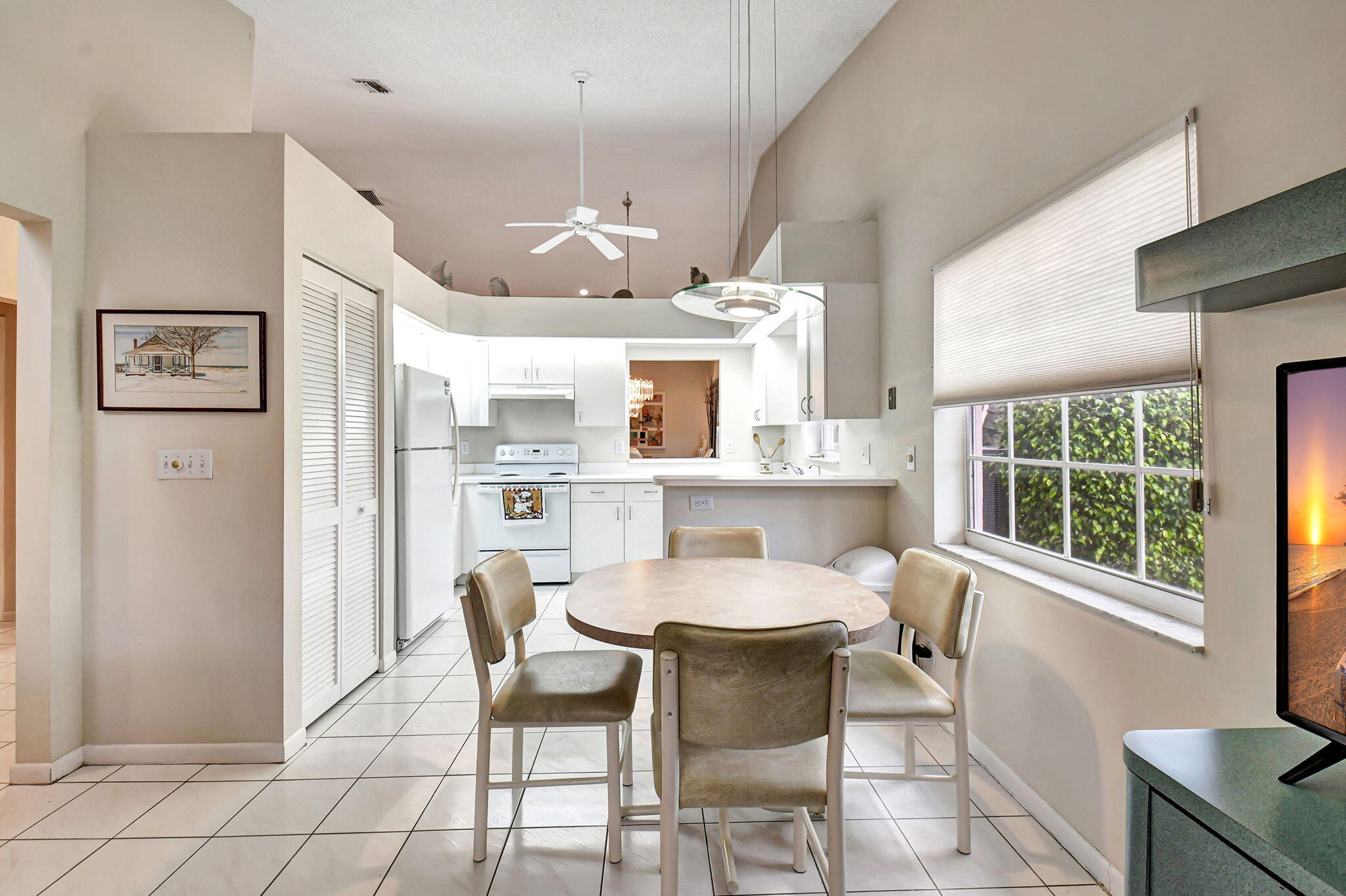 7921 Sandy Pointe Drive Delray Beach, FL 33446 - Photo 9 of 33 Den into kitchen