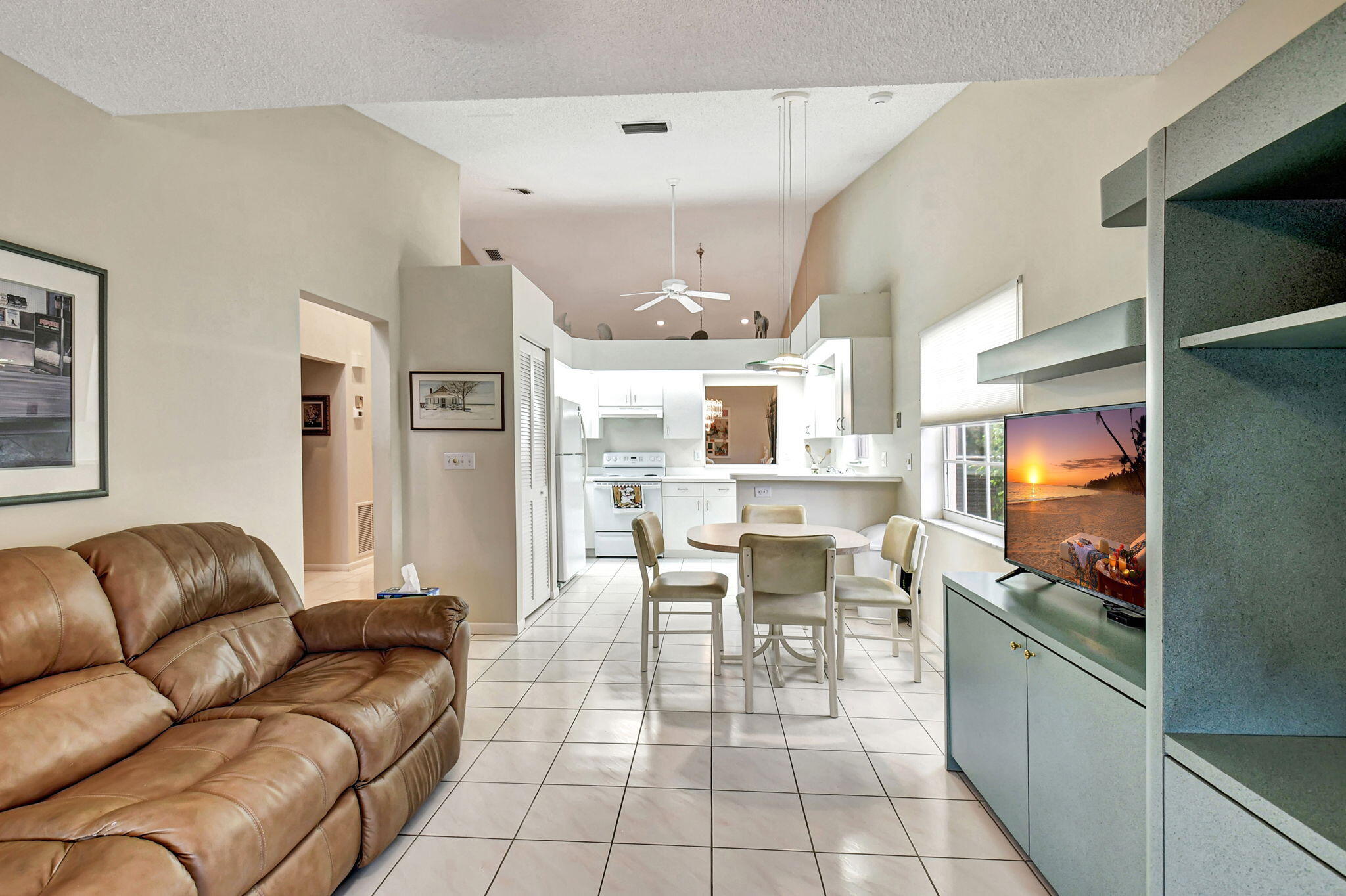 7921 Sandy Pointe Drive Delray Beach, FL 33446 - Photo 10 of 33 Den into Kitchen