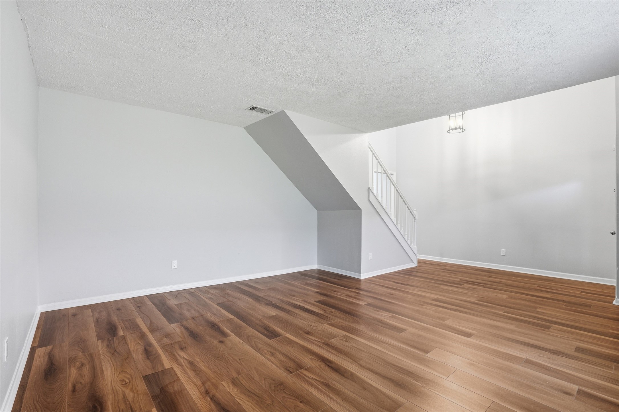 11647 Sabo Road Houston, TX 77089 - Photo 14 of 36 a view of an empty room with wooden floor