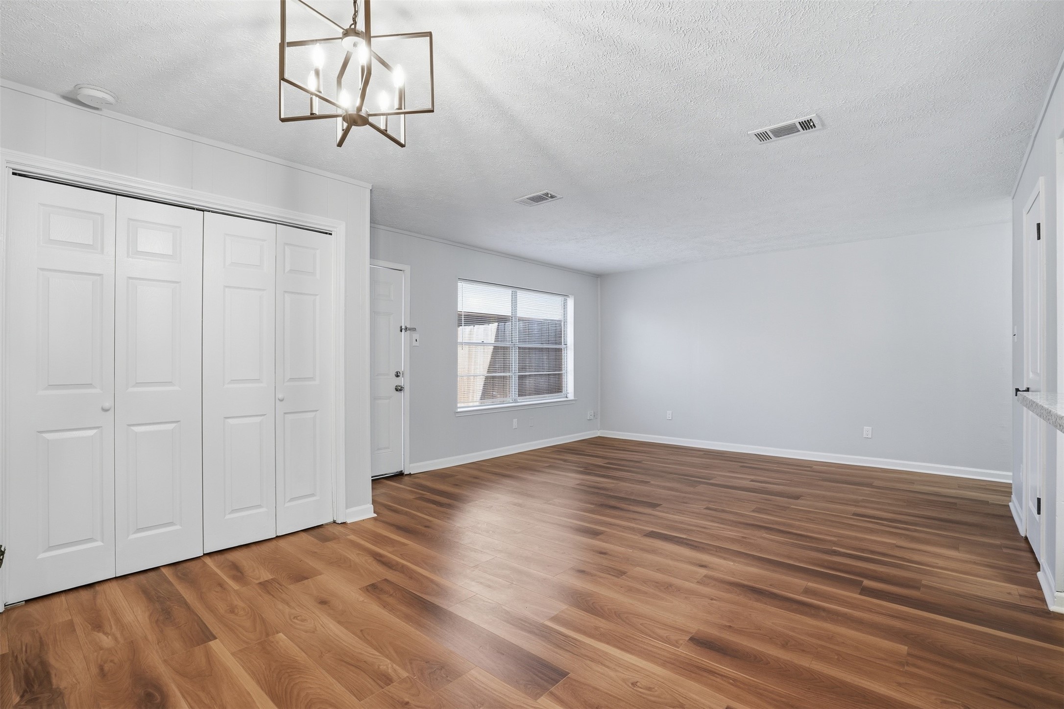 11647 Sabo Road Houston, TX 77089 - Photo 20 of 36 a view of empty room with wooden floor and ceiling fan