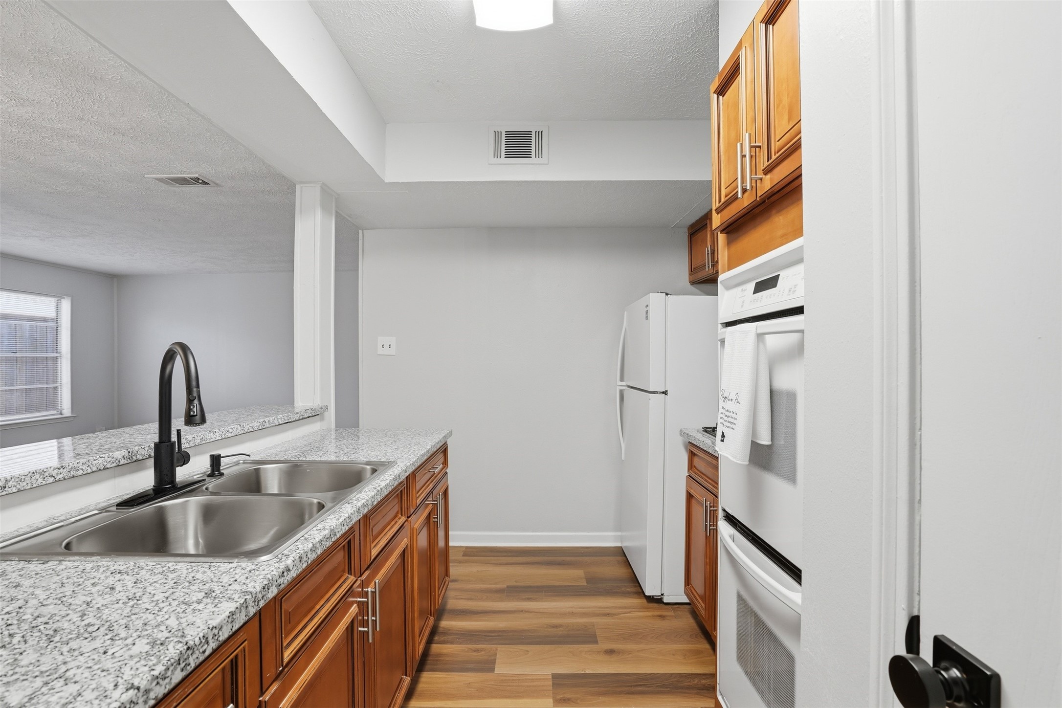 11647 Sabo Road Houston, TX 77089 - Photo 21 of 36 a kitchen with stainless steel appliances granite countertop a sink and a refrigerator