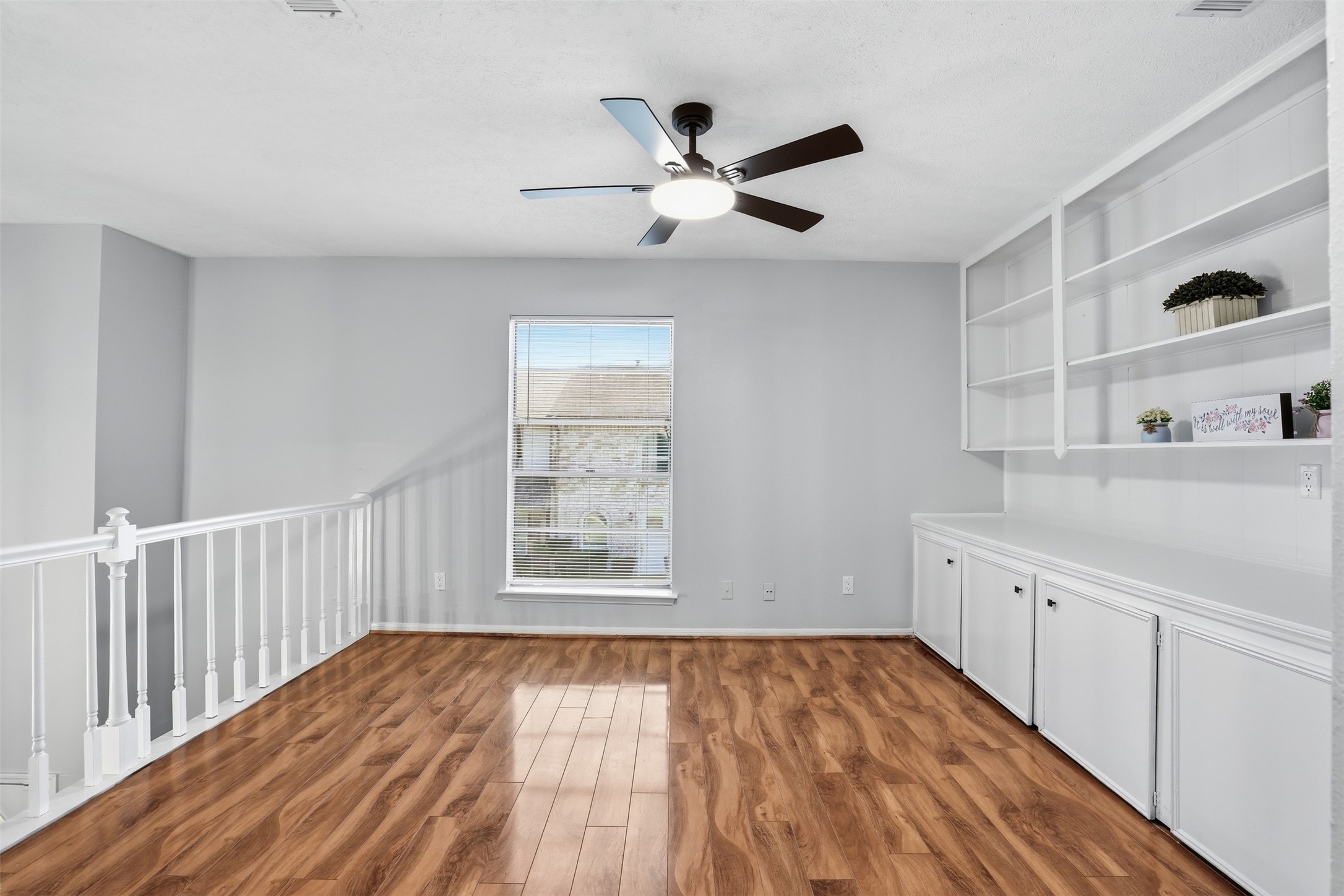 11647 Sabo Road Houston, TX 77089 - Photo 23 of 36 wooden floor in an empty room with a window