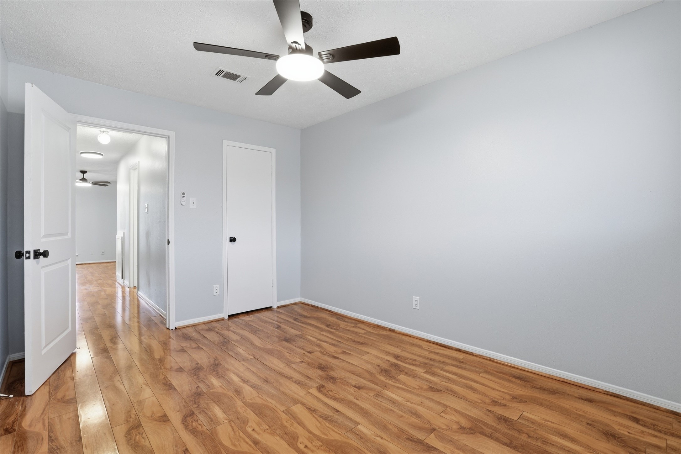 11647 Sabo Road Houston, TX 77089 - Photo 26 of 36 a view of empty room with wooden floor