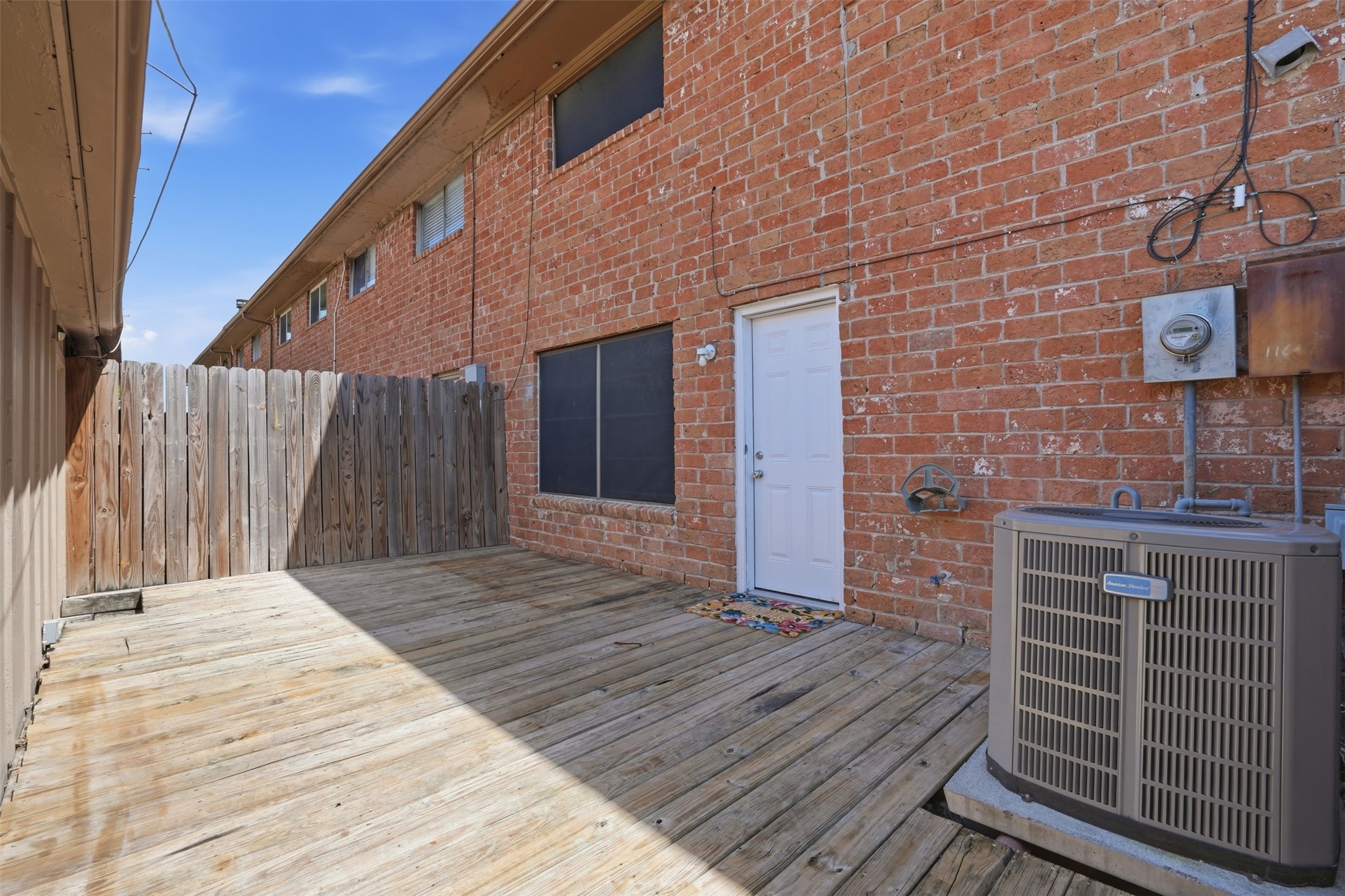 11647 Sabo Road Houston, TX 77089 - Photo 32 of 36 a backyard of a house with wooden floor