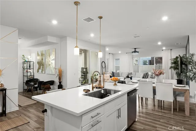 a kitchen that has a table and chairs in it