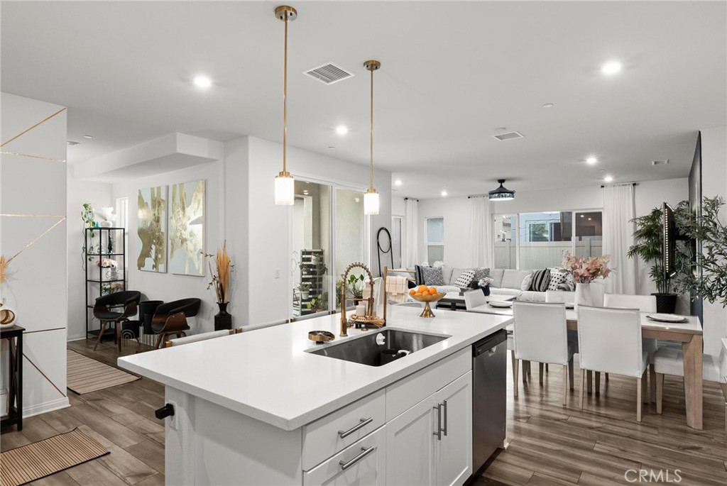 352 Alice Avenue Rialto, CA 92376 - Photo 17 of 41 a kitchen that has a table and chairs in it