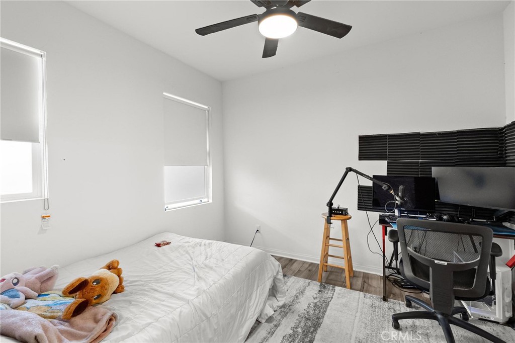 352 Alice Avenue Rialto, CA 92376 - Photo 20 of 41 a bedroom with a bed and a chair